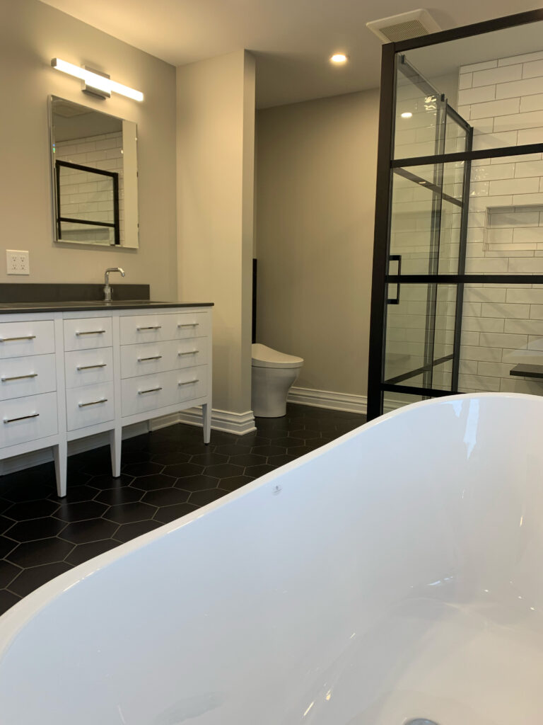 Bathroom with freestanding tub and glass shower