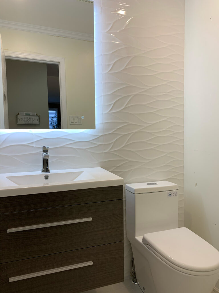 Bathroom vanity with textured wall tile